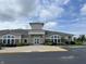 Attractive clubhouse exterior with lush landscaping and ample parking at 4905 Lilium Dr, Plainfield, IN 46168