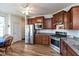 Modern kitchen with stainless steel appliances, granite countertops, and wood floors, offering a functional space at 4905 Lilium Dr, Plainfield, IN 46168
