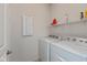 Clean laundry room with modern white washer and dryer at 4905 Lilium Dr, Plainfield, IN 46168
