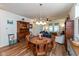 Open-concept living room with wood floors, natural light, and decorative furnishings at 4905 Lilium Dr, Plainfield, IN 46168