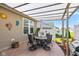 Covered patio with an outdoor dining set, perfect for entertaining in the backyard at 4905 Lilium Dr, Plainfield, IN 46168