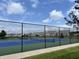 Outdoor tennis courts with blue and green surface and surrounding community homes at 4905 Lilium Dr, Plainfield, IN 46168