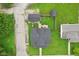 Birds-eye view of property showcasing the home, sheds, and surrounding green space at 514 E 2Nd St, Sheridan, IN 46069