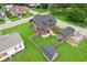 Aerial view of a home featuring a backyard with a deck and storage sheds at 514 E 2Nd St, Sheridan, IN 46069