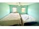 Bedroom features two twin beds, updated light fixture and windows at 514 E 2Nd St, Sheridan, IN 46069