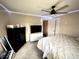 Inviting bedroom with television, storage drawers, and cozy decor at 514 E 2Nd St, Sheridan, IN 46069