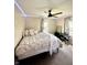 Comfortable bedroom featuring a queen bed, soft lighting, and a music keyboard at 514 E 2Nd St, Sheridan, IN 46069