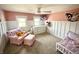Cozy bedroom with neutral carpet, pink walls, and board and batten trim at 514 E 2Nd St, Sheridan, IN 46069