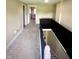 Second-floor hallway featuring carpet floors and an iron railing at 514 E 2Nd St, Sheridan, IN 46069