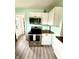 Charming kitchen features stainless steel appliances, wood countertops, and updated cabinets at 514 E 2Nd St, Sheridan, IN 46069