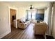Cozy living room with a plush sofa, recliner, flat-screen TV, and doorway access to a nearby bathroom at 514 E 2Nd St, Sheridan, IN 46069