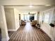 Bright living room featuring hardwood floors and comfortable seating arrangements at 514 E 2Nd St, Sheridan, IN 46069