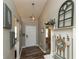 Welcoming entryway with wood floors, neutral paint, and decorative accents at 59 Millet Ct, Danville, IN 46122