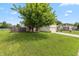 Inviting single-story home with green lawn and mature shade tree at 59 Millet Ct, Danville, IN 46122