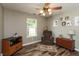 Cozy living area with a comfortable chair, window, and decorative accents on wooden floor at 59 Millet Ct, Danville, IN 46122