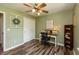 Office area featuring a desk, a ceiling fan, closet space and a decorative wall wreath at 59 Millet Ct, Danville, IN 46122