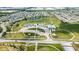 An aerial view of community facilities including a basketball court, playground, and parking at 6137 Hardwick Dr, Whitestown, IN 46075