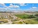 An aerial view displays a residential community with commercial development, roads, and green spaces at 6137 Hardwick Dr, Whitestown, IN 46075
