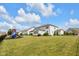 Spacious backyard with lush lawn, swing set, and surrounding fence, ideal for outdoor enjoyment at 6137 Hardwick Dr, Whitestown, IN 46075