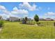 Expansive backyard with lush green grass, fenced perimeter, and a playset, perfect for Gathering activities at 6137 Hardwick Dr, Whitestown, IN 46075