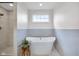 Luxurious bathroom showcasing a freestanding soaking tub and a separate glass-enclosed shower with stylish tile at 6137 Hardwick Dr, Whitestown, IN 46075