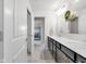 Bright bathroom with double sinks, quartz countertops, and modern black cabinetry at 6137 Hardwick Dr, Whitestown, IN 46075
