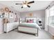 Beautifully decorated bedroom featuring a queen bed, dresser, and a calming lilac color scheme at 6137 Hardwick Dr, Whitestown, IN 46075