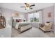 Charming bedroom with light purple walls, neutral furniture, and plenty of natural light at 6137 Hardwick Dr, Whitestown, IN 46075