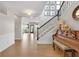 Inviting foyer with hardwood floors, staircase, and elegant decor at 6137 Hardwick Dr, Whitestown, IN 46075