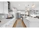 Modern kitchen with white cabinetry, stainless steel appliances, and a center island at 6137 Hardwick Dr, Whitestown, IN 46075
