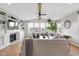 Spacious living room with a cozy fireplace, built-in shelving, ample natural light, and stylish furnishings at 6137 Hardwick Dr, Whitestown, IN 46075