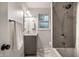 Modern bathroom with tile shower, new fixtures, and gray vanity at 7082 Muskrat Dr, Nineveh, IN 46164