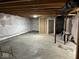 Unfinished basement space with exposed ceiling and doorway at 7532 Gold Rush Ct, Camby, IN 46113