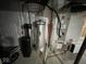 Basement area featuring HVAC equipment, hot water heater, and water filter at 7532 Gold Rush Ct, Camby, IN 46113