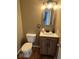 A half bathroom with vanity and tile floor at 7532 Gold Rush Ct, Camby, IN 46113