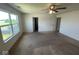 Bedroom featuring a ceiling fan, neutral walls, carpet flooring and natural lighting from a window at 7532 Gold Rush Ct, Camby, IN 46113