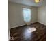 Bedroom featuring hardwood floors, white walls, and a sunlit window at 7532 Gold Rush Ct, Camby, IN 46113