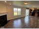 Living space boasting a fireplace, sliding glass doors to the backyard, and an open kitchen area at 7532 Gold Rush Ct, Camby, IN 46113