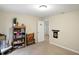 Spare bedroom with bookshelf, bench and open door at 8380 Kolven Dr, Avon, IN 46123