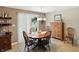 Dining area adjacent to a sliding glass door that leads to the back yard at 8380 Kolven Dr, Avon, IN 46123