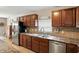 Kitchen with stainless steel appliances, tile countertops, backsplash, and plenty of cabinet space at 8380 Kolven Dr, Avon, IN 46123