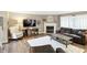 Cozy living room features hardwood floors, a fireplace, and ample seating at 8380 Kolven Dr, Avon, IN 46123
