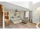 Bright and airy living room with a view to the kitchen and front entry at 8380 Kolven Dr, Avon, IN 46123