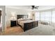 Spacious main bedroom features a large bed, nightstands, and an alcove with bright windows and seating at 8380 Kolven Dr, Avon, IN 46123