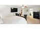 Spacious primary bedroom with a large bed, ceiling fan, TV, and a walk-in closet at 8380 Kolven Dr, Avon, IN 46123