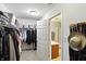 Walk-in closet with lots of hanging storage, shelving, and access to the Primary bathroom at 8380 Kolven Dr, Avon, IN 46123