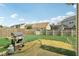 Large backyard with a grill and lawn at 958 Denton Ct, Westfield, IN 46074