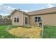 The backyard features a small patio area, garden, and siding on the rear of the home at 958 Denton Ct, Westfield, IN 46074