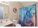 Bright bathroom with a single vanity, a toilet, and a shower with a stylish blue shower curtain at 958 Denton Ct, Westfield, IN 46074