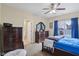 This cozy bedroom is complete with carpeted floors and complemented by a ceiling fan at 958 Denton Ct, Westfield, IN 46074